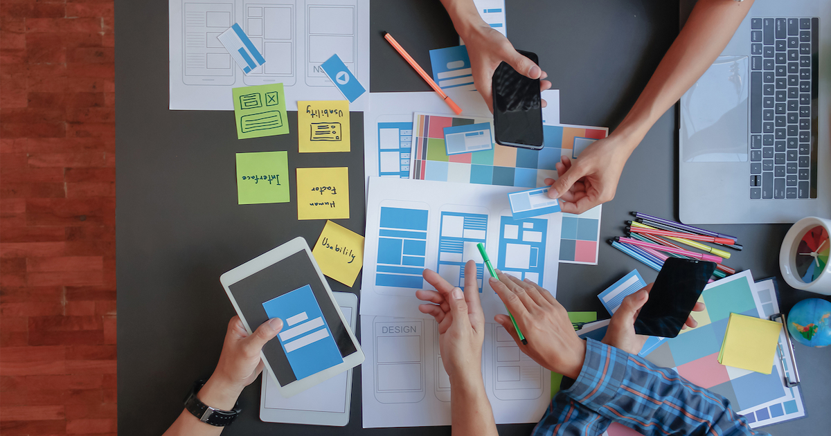 office scenery of people considering website layout